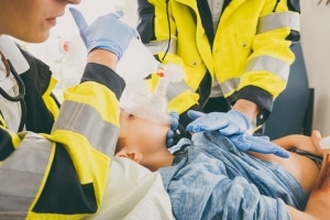 Close up of EMS professionals helping a child